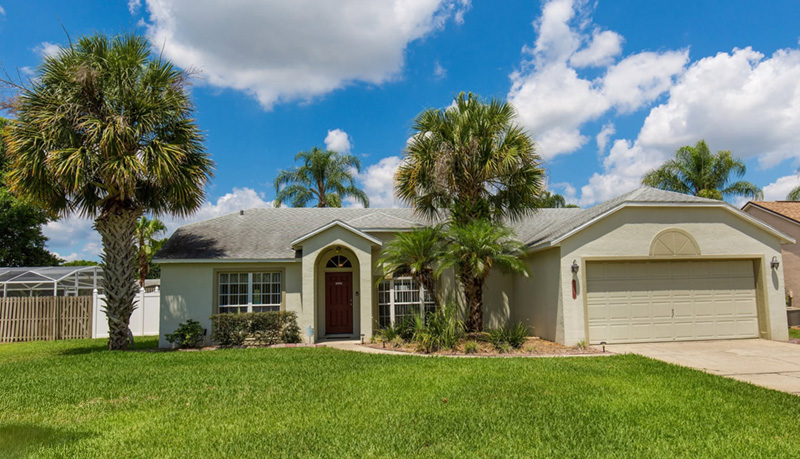 Front exterior and lawn at Florida Fun Villa