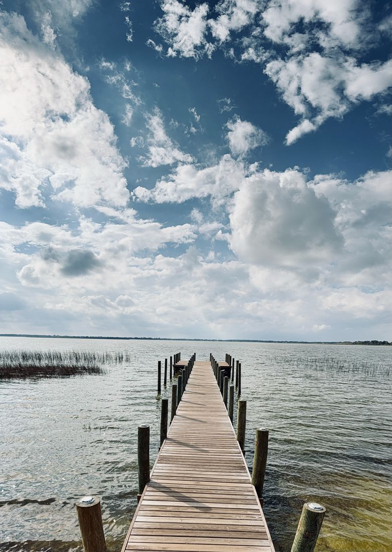 Wooden pier extending over Florida water