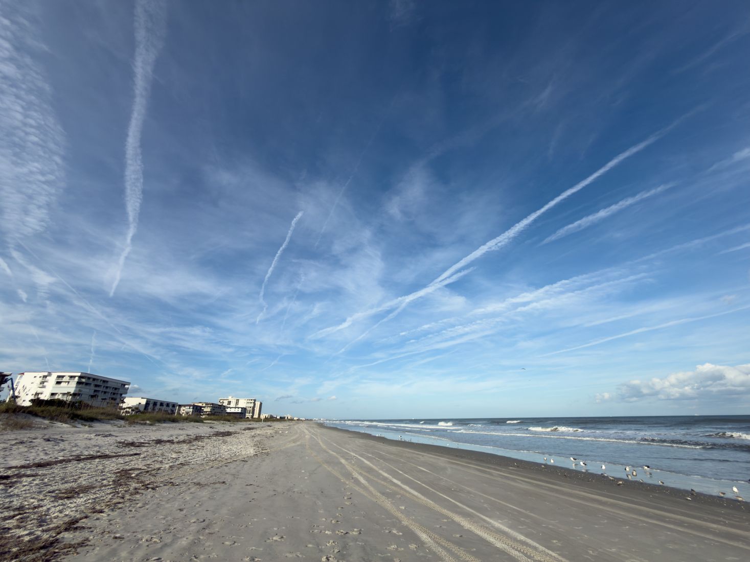 Beach with pale sand and blue sky